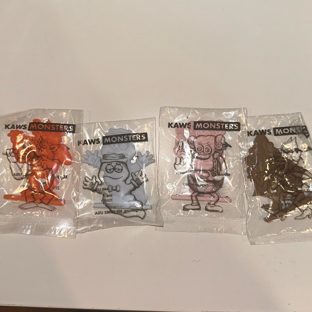 KAWS X MONSTERS CEREAL SET OF FOUR CEREAL FIGURINES